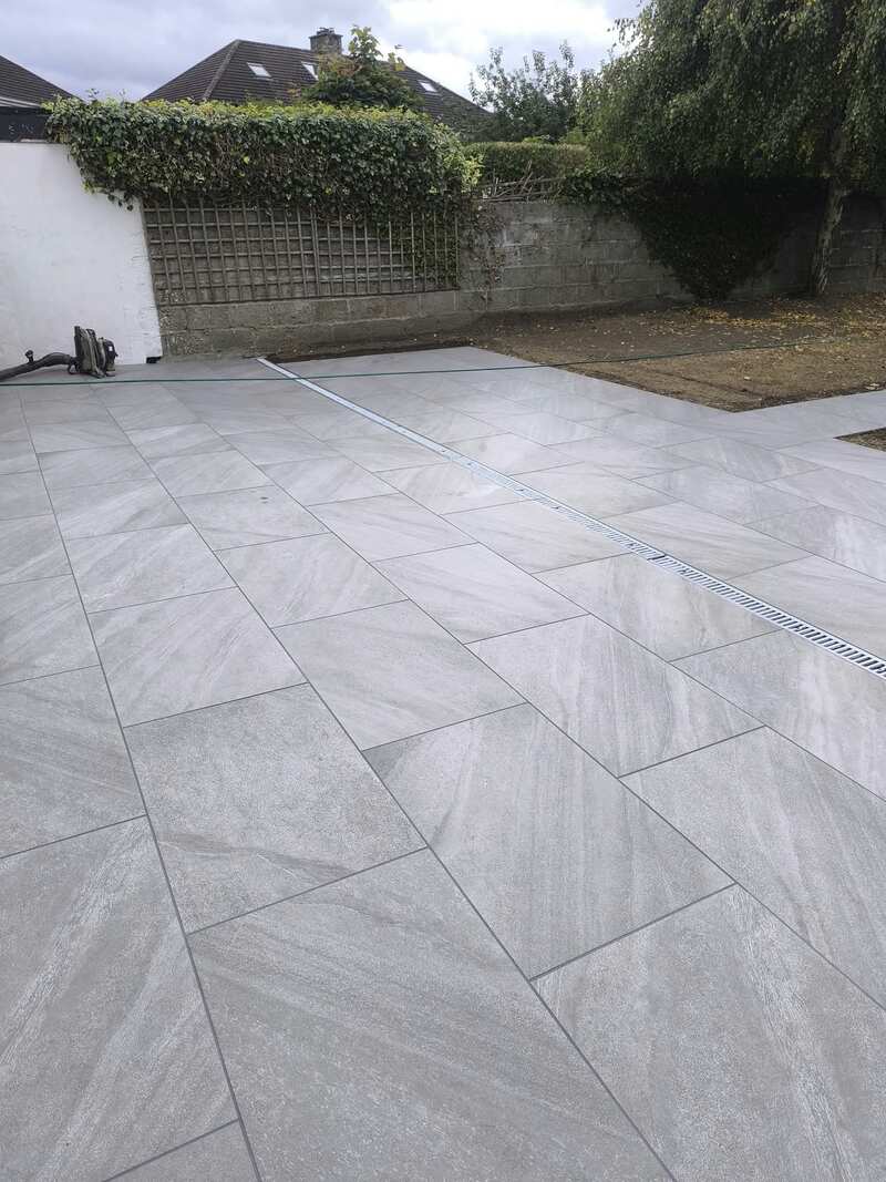 Porcelain patio tiles with stainless steel drainage channel
